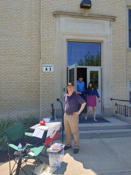 Local GOP Committee Member Doug Mitchell staffs a table outside a voting precinct in Mt. Lebanon, Pa. on May 17. (Photo by Jeff Louderback)