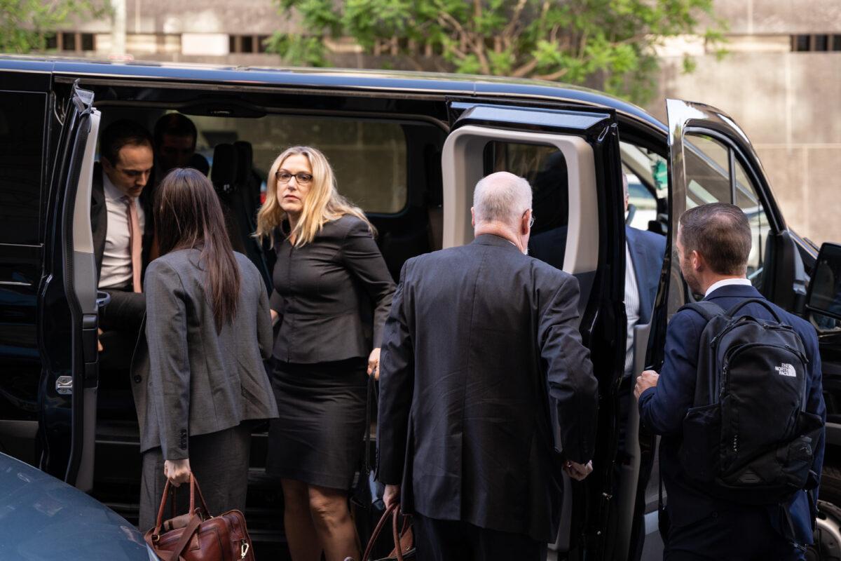 Trial attorneys from the office of special counsel John Durham, including Deborah Brittain Shaw, arrive at federal court in Washington on May 18, 2022. (Teng Chen for The Epoch Times)