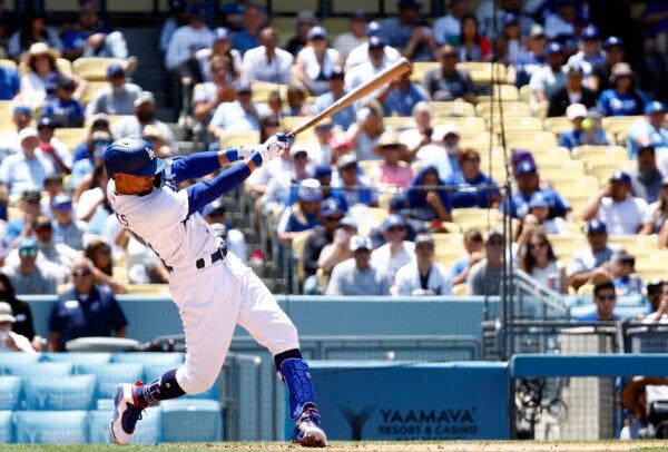 Mookie Betts #50 of the Los Angeles Dodgers hits a two-run home run against the Arizona Diamondbacks in the sixth inning during game one of a doubleheader at Dodger Stadium, in Los Angeles, on May 17, 2022. (Ronald Martinez/Getty Images)