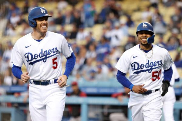 Freddie Freeman #5 and Mookie Betts #50 of the Los Angeles Dodgers react after scoring on a two-run single off the bat of Trea Turner during the first inning in game two of a doubleheader against the Arizona Diamondbacks at Dodger Stadium, in Los Angeles, on May 17, 2022. (Katelyn Mulcahy/Getty Images)