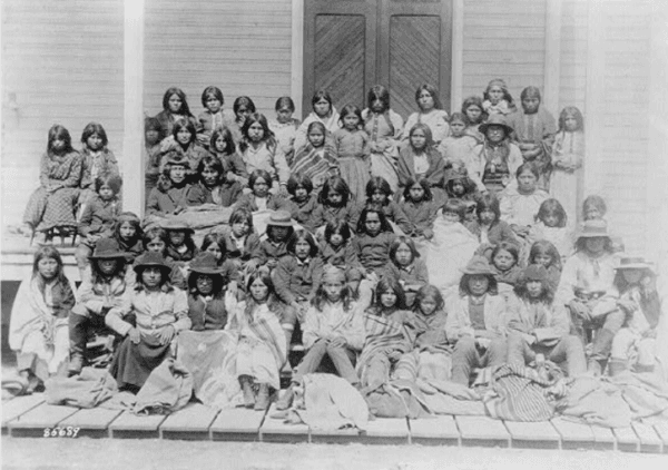 Ciricahua Apaches at the Carlisle Indian School, Penn., 1885 or 1886, as they looked upon arrival at the School. (Library of Congress)