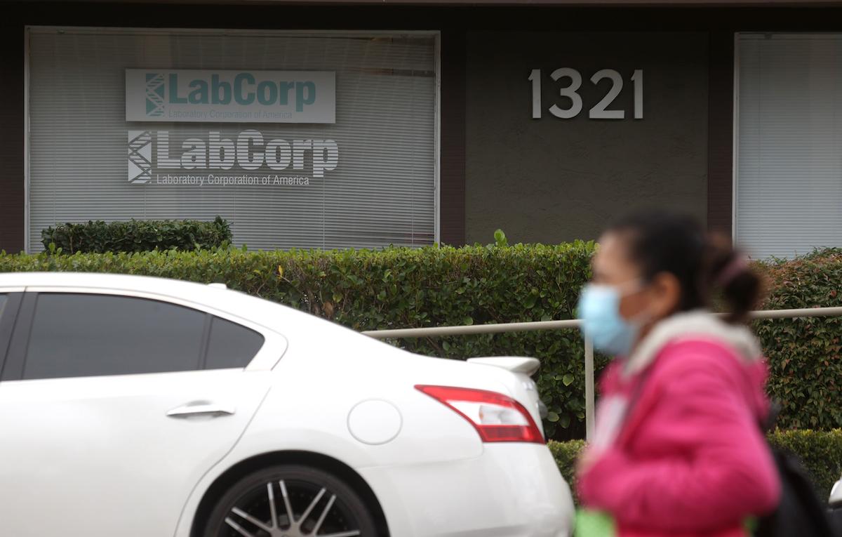 A pedestrian walks by a LabCorp office in Greenbrae, California, on Feb. 11, 2021. (Justin Sullivan/Getty Images)
