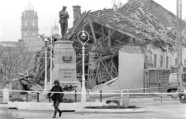 A soldier stands in front of a devastated community centre after the IRA bombing of a Remembrance Day ceremony in the town of Enniskillen, County Fermanagh, on Nov. 9, 1987. (PA Media)