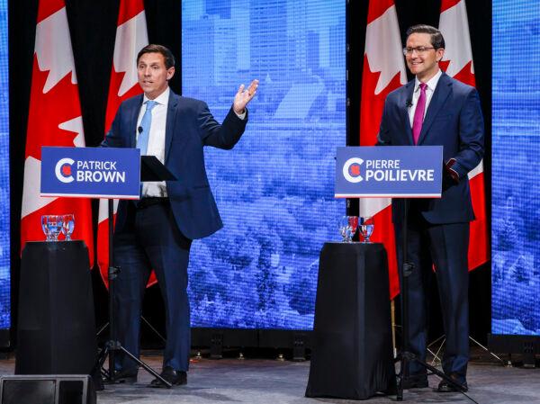 Patrick Brown (L) and Pierre Poilievre trade barbs at the Conservative Party of Canada English leadership debate in Edmonton on May 11, 2022. (The Canadian Press/Jeff McIntosh)
