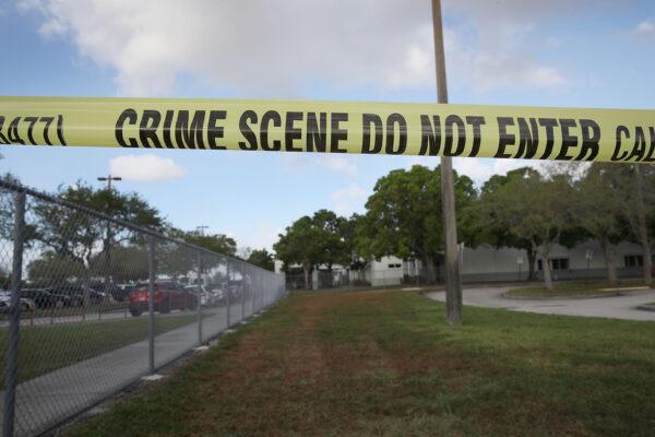 Crime scene tape outside Marjory Stoneman Douglas High School as teachers and staff are allowed to return to the school for the first time since the mass shooting on campus in Parkland, Fla., on Feb. 23, 2018. (Joe Raedle/Getty Images)