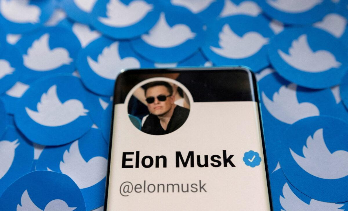 Elon Musk's Twitter profile is seen on a smartphone placed on printed Twitter logos in this picture illustration taken April 28, 2022. (Dado Ruvic/Illustration/Reuters)