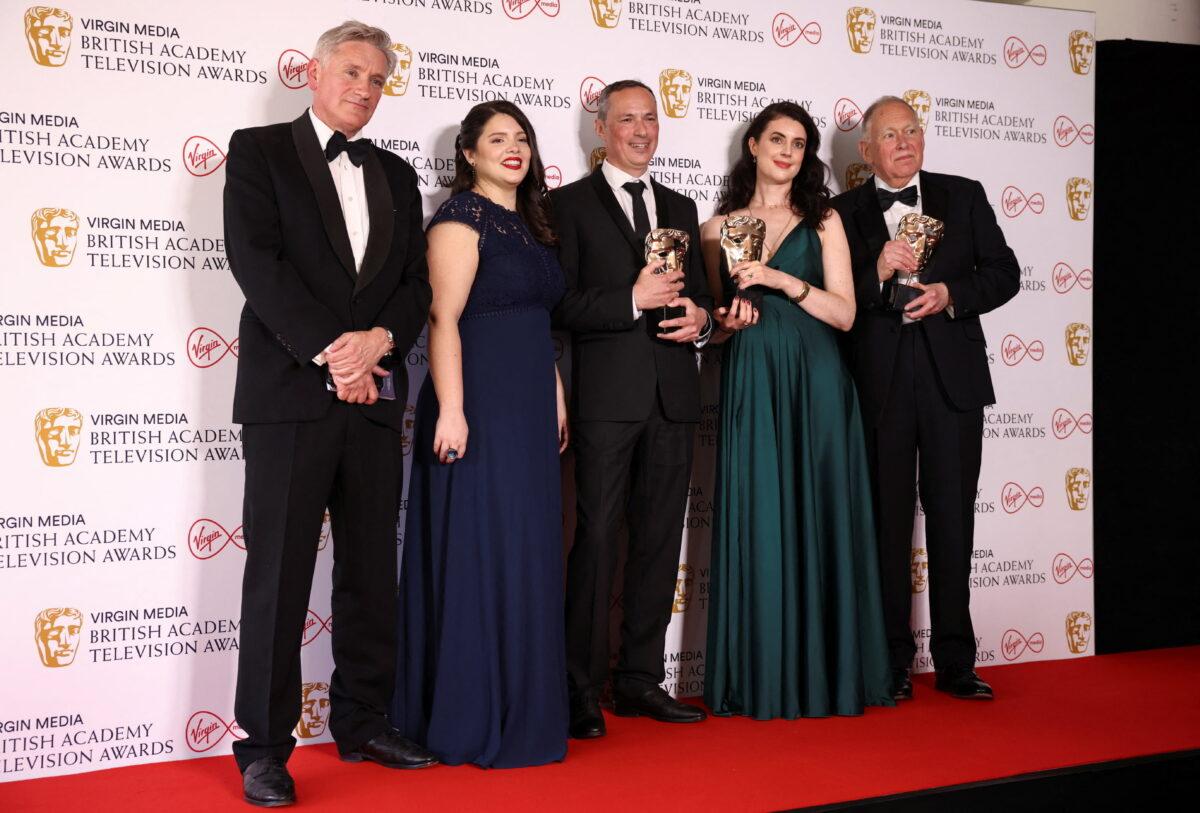 Director Sarah Collinson poses with the team of the documentary "Fearless: The Women Fighting Putin" and the award for "Best Current Affairs" at the British Academy Television Awards in London on May 8, 2022. (Henry Nicholls/Reuters)