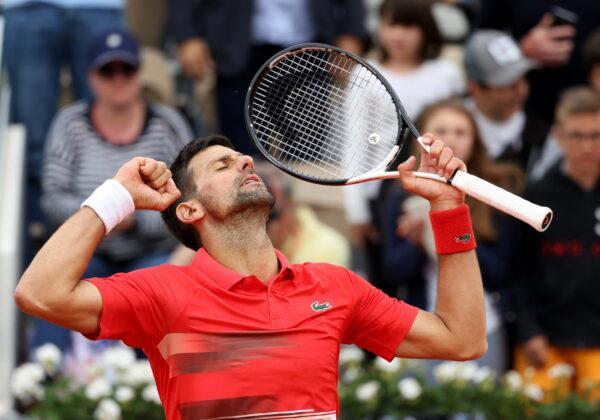 Serbia's Novak Djokovic celebrates winning his second round match against Slovakia's Alex Molcan at the French Open in Roland Garros stadium in Paris on May 25, 2022. (Yves Herman/Reuters)
