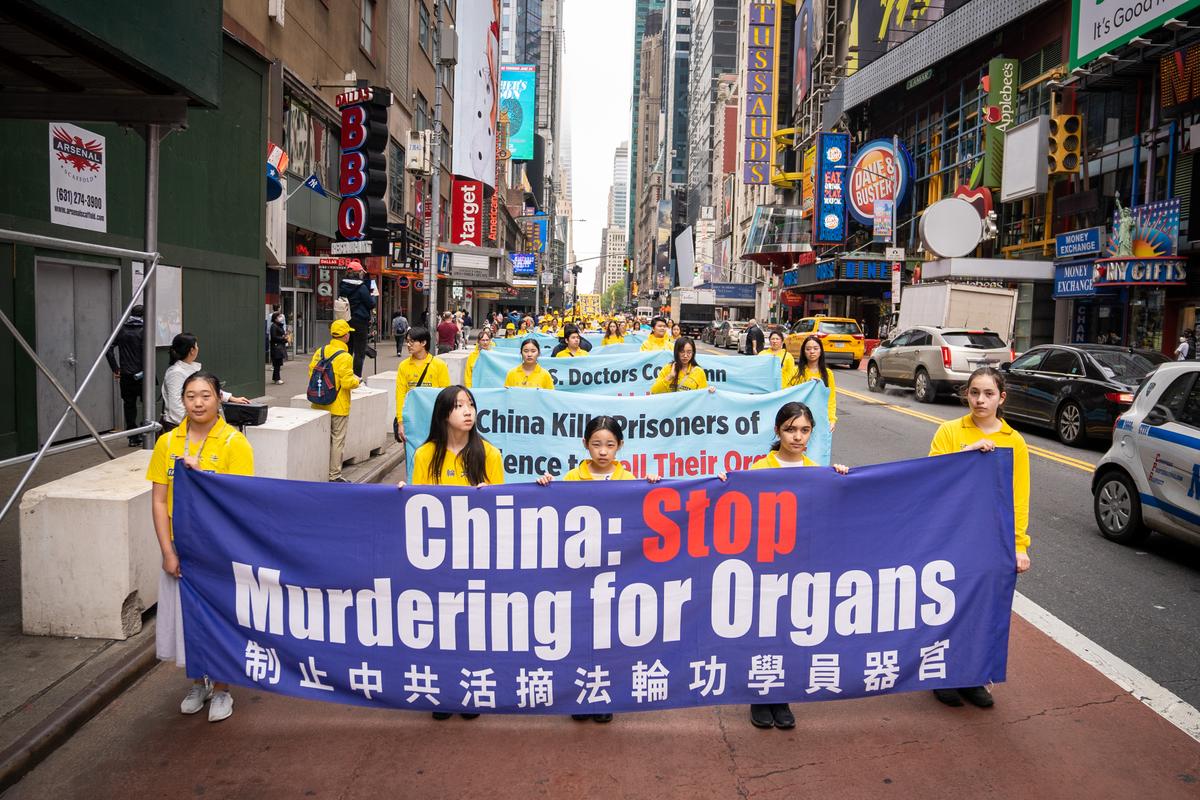Falun Gong practitioners take part in a parade marking the 30th anniversary of the spiritual discipline's introduction to the public, in New York on May 13, 2022. (Samira Bouaou/The Epoch Times)