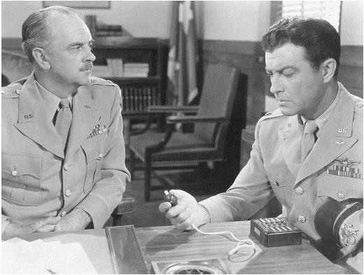 Larry Keating (L) as Gen. Brent and Robert Taylor as Paul W. Tibbets Jr. in "Above and Beyond." (Metro-Goldwyn-Mayer)