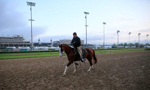 Trainer D. Wayne Lukas watches his horses train during the morning exercise session in preparation for the 140th Kentucky Derby at Churchill Downs in Louisville, Ky., on April 30, 2014. (Rob Carr/Getty Images)