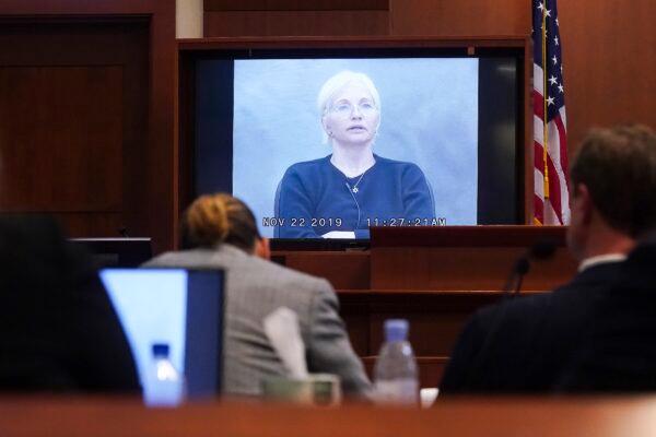  Actress Ellen Barkin testifies in a previously recorded video deposition at the Fairfax County Circuit Courthouse in Fairfax, Va., on May 19, 2022. (Shawn Thew/Pool Photo via AP)