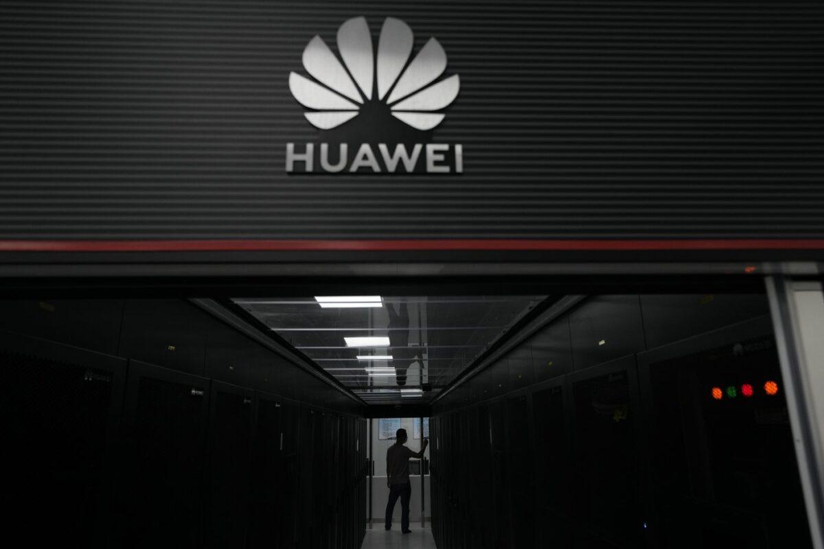 A technician stands at the entrance to a Huawei 5G data server center at the Guangdong Second Provincial General Hospital in Guangzhou, in southern China's Guangdong Province, on Sept. 26, 2021. (The Canadian Press/AP-Ng Han Guan)
