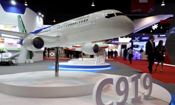 A model of the Commercial Aircraft Corp. of China Ltd. (Comac) C919 aircraft at the Singapore Airshow in Singapore on Feb. 6, 2018. (Seong Joon Cho/Bloomberg via Getty Images)