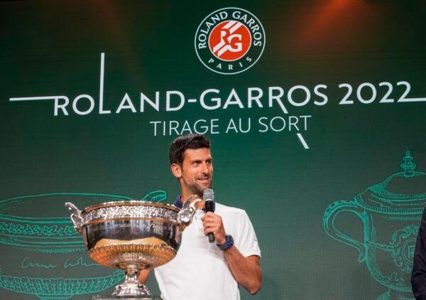 Defending champion Serbia's Novak Djokovic speaks next to the cup during the draw of the French Open tennis tournament at the Roland Garros stadium in Paris, on May 19, 2022. (Michel Euler/AP Photo)