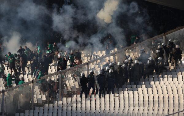 Police and fans clash inside the Athens Olympic Stadium in Athens, Greece, on May 21, 2022 (Alkis Konstantinidis/Reuters)