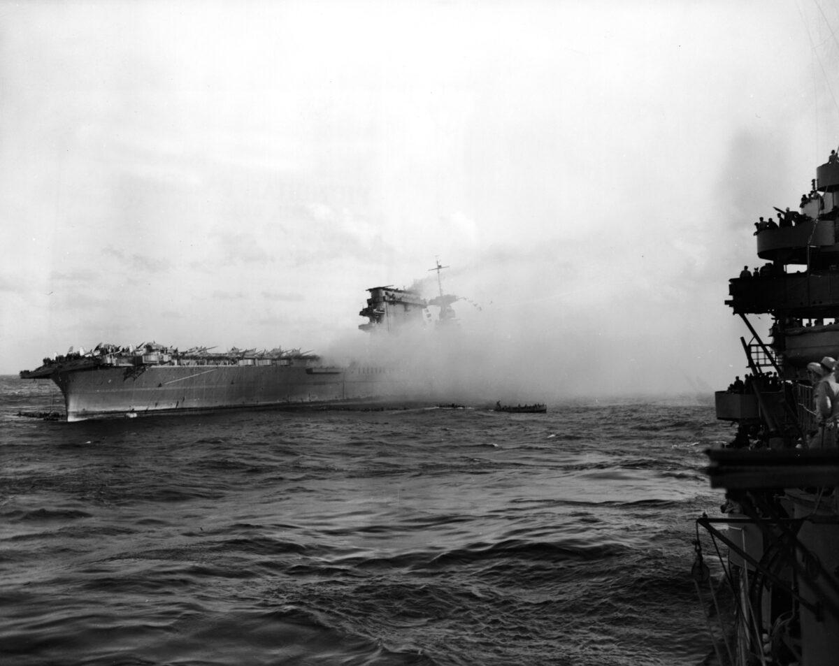Smoke pours from the USS Lexington aircraft carrier from Japanese torpedo hits during the Battle of the Coral Sea in World War II, 1942. (Pictorial Parade/Getty Images)