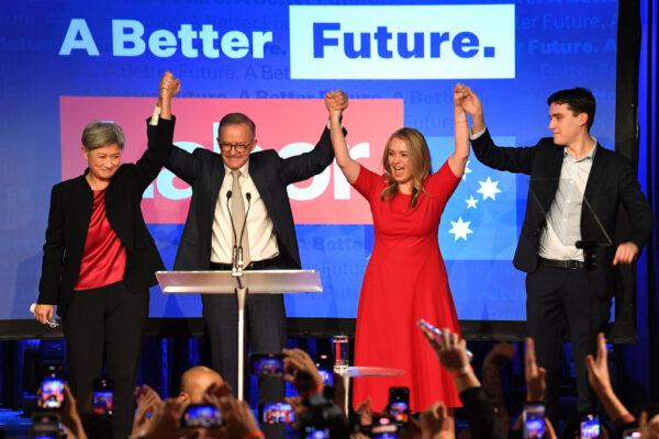 Incoming foreign affairs minister Senator Penny Wong (L), Labor Leader Anthony Albanese, his partner Jodie Haydon, and his son Nathan Albanese celebrate victory during the Labor Party election night event in Sydney, Australia, on May 21, 2022. (James D. Morgan/Getty Images)