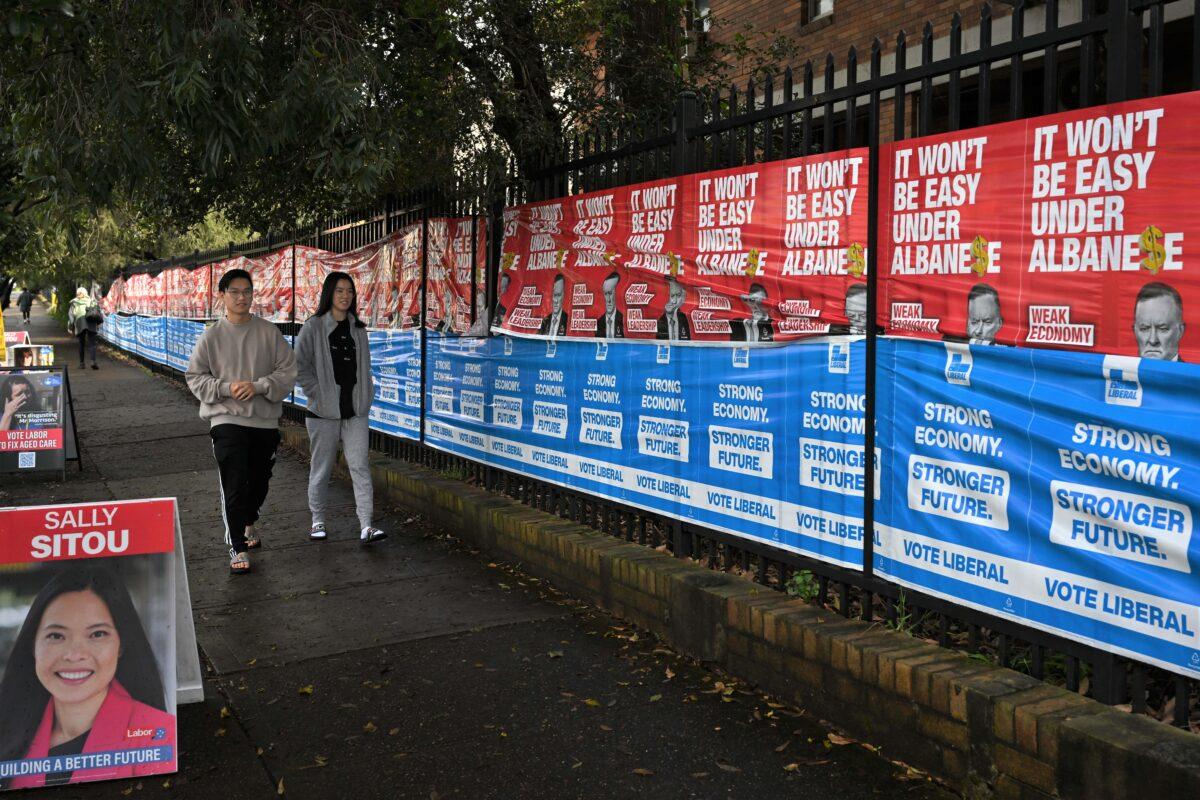 An abundance of Liberal Party signage at the Strathfield North Public School polling booth on Federal Election day, in the seat of Reid, in Sydney, Australia, on May 21, 2022. (AAP Image/Dean Lewins)
