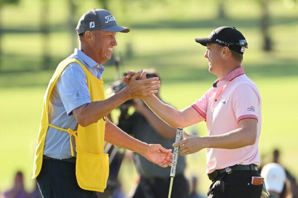 Justin Thomas of the United States reacts to his winning putt on the 18th hole with caddie Jim "Bones" Mackay, the third playoff hole during the final round of the 2022 PGA Championship at Southern Hills Country Club, in Tulsa, on May 22, 2022. (Ross Kinnaird/Getty Images)