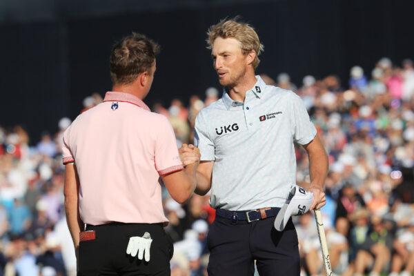 Justin Thomas of the United States shakes hands with Will Zalatoris of the United States on the 18th green, the third playoff hole during the final round of the 2022 PGA Championship at Southern Hills Country Club, in Tulsa, on May 22, 2022. (Sam Greenwood/Getty Images)