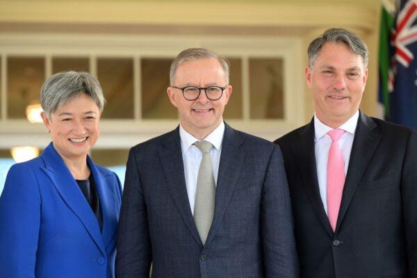 Australia's new Prime Minister Anthony Albanese (C) poses with his new cabinet ministers, Penny Wong (L) and Richard Marles, after the oath-taking ceremony at Government House in Canberra, Australia, on May 23, 2022. (Saeed Khan/AFP via Getty Images)