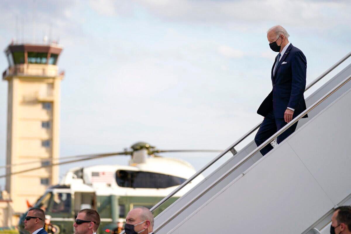 U.S. President Joe Biden disembarks from Air Force One on his arrival at Yokota Air Base, in Fussa, on the outskirt of Tokyo, on May 22, 2022. (Evan Vucci/AP Photo)