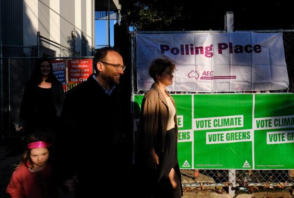Australian Greens leader Adam Bandt is seen leaving Kensington Primary school with his family after voting on Federal Election day in Melbourne, Australia, on May 21, 2022. (AAP Image/Luis Ascui)
