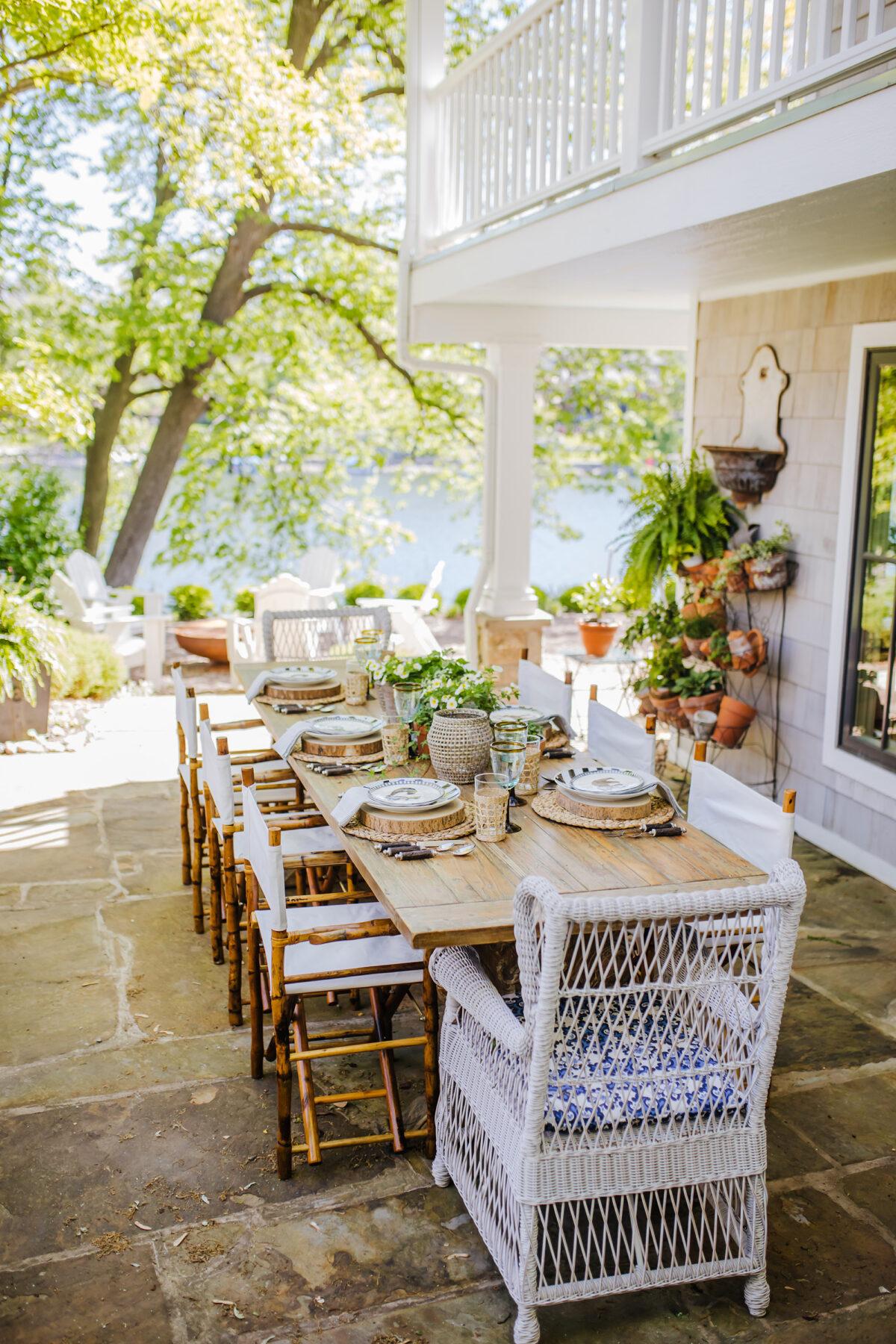 Oversized tables with lots of room for dishes and decorations are a must when it comes to outdoor entertaining. (Nell Hill’s/TNS)