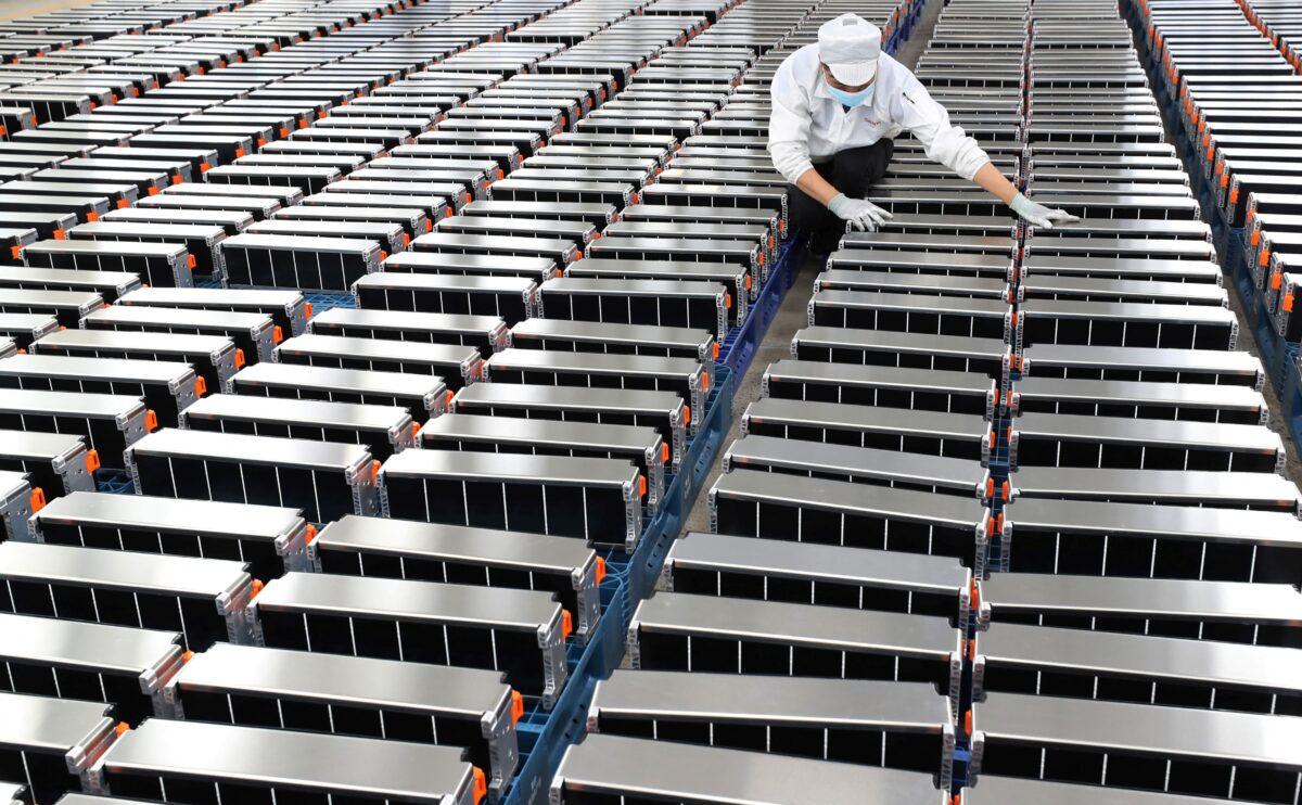 A worker with electric car batteries at a factory for Xinwangda Electric Vehicle Battery Co. Ltd, in Nanjing in China's eastern Jiangsu Province, on March 12, 2021. (STR/AFP via Getty Images)