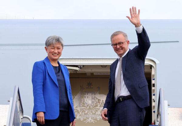  Prime Minister Anthony Albanese stands with newly appointed Foreign Minister Penny Wong at the door of their plane in Canberra, Australia, on May 23, 2022. (David Gray/Getty Images)
