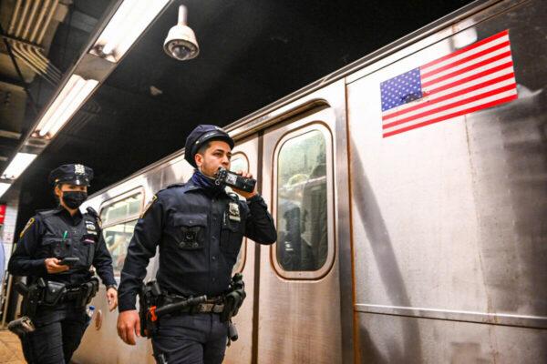 New York City police investigate an incident on an Uptown 4 subway after an emergency brake was pulled near Union Square in New York on April 12, 2022. (Alexi J. Rosenfeld/Getty Images)