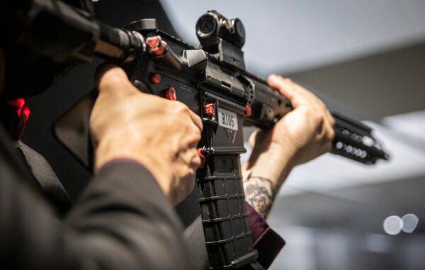 A man uses an assault rifle in Stanton, Calif., on May 3, 2021. (John Fredricks/The Epoch Times)