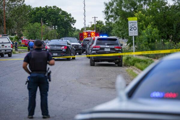 Police cordon off the streets around Robb Elementary School after a mass shooting, in Uvalde, Texas, on May 24, 2022. (Charlotte Cuthbertson/The Epoch Times)