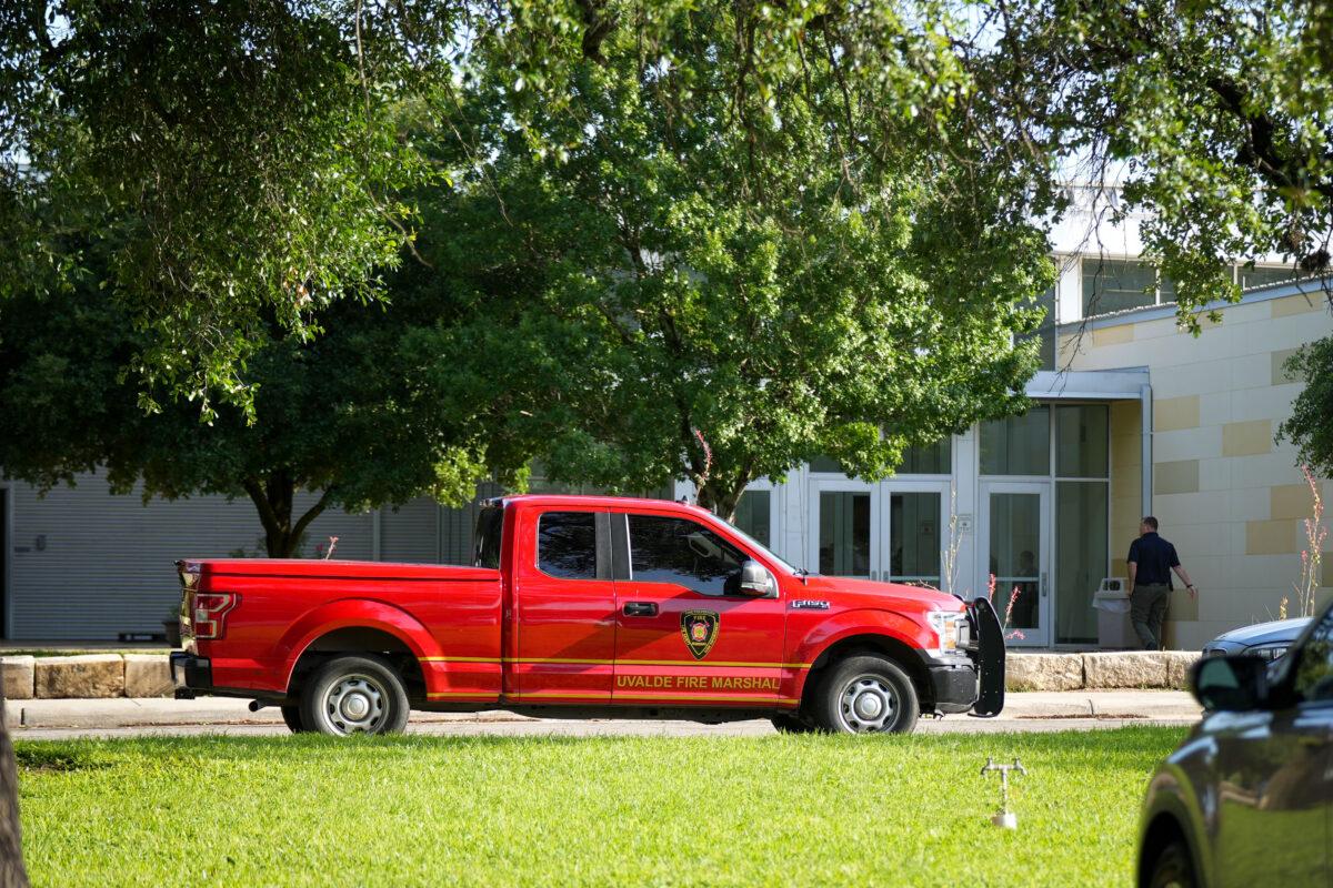 The Uvalde Fire Marshal and other law enforcement officials at the Uvalde Civic Center, which is operating as a grief counseling location for community members affected by the mass shooting at Robb Elementary School the day prior, in Uvalde, Texas, on May 24, 2022. (Charlotte Cuthbertson/The Epoch Times)