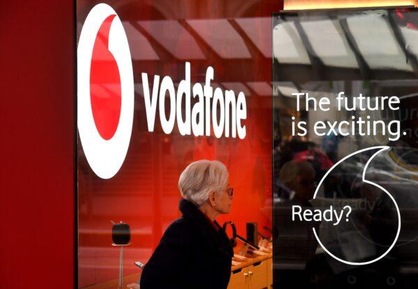 A woman walks past a Vodafone store in Melbourne, Australia, on Aug. 30, 2018. (William West/AFP via Getty Images)