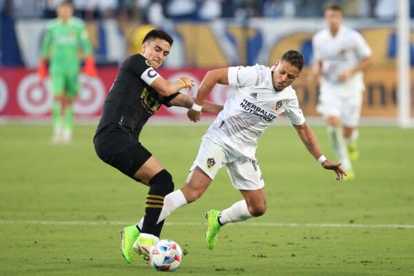  Eduard Atuesta #20 of Los Angeles FC and Javier Hernandez #14 of Los Angeles Galaxy fight for control of the ball during the second half of a game at Dignity Health Sports Park, in Carson, Calif., on October 3, 2021. (Katharine Lotze/Getty Images)