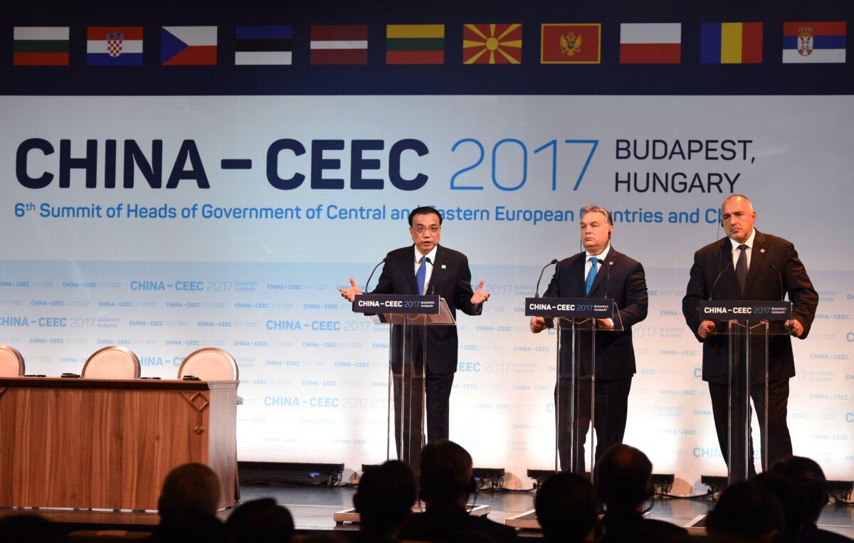 (L-R) Chinese Premier Li Keqiang, Hungarian Prime Minister Viktor Orban, and Bulgarian Premier Boyko Borisov speak during an economic forum attended by 16 central and eastern European leaders in Budapest, Hungary, on Nov. 27, 2017. (Attila Kisbenededk/AFP via Getty Images)