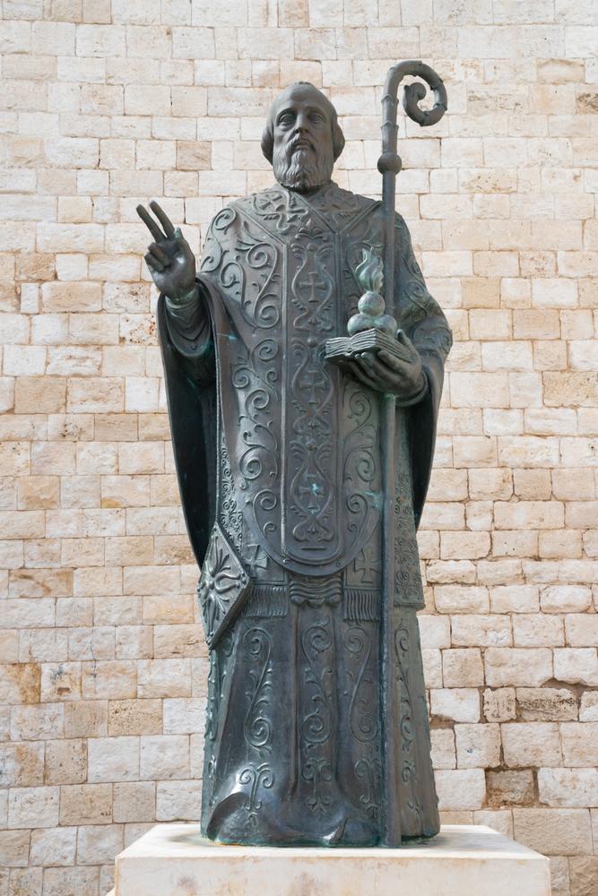 The bronze statue of St. Nicholas of Bari in front of the Basilica San Nicola. (Renata Sedmakova/Shutterstock)