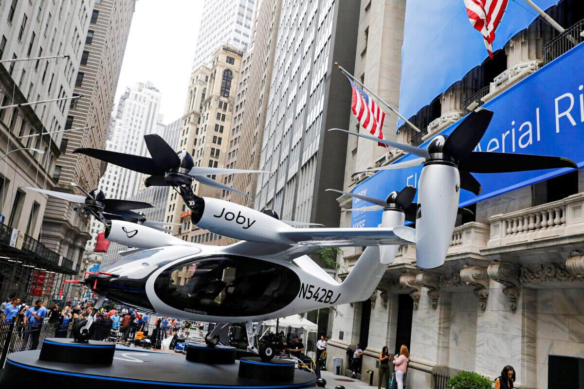 A Joby Aviation air taxi outside of the New York Stock Exchange ahead of its listing in the Manhattan borough of New York City, on Aug. 11, 2021. (Andrew Kelly/Reuters)