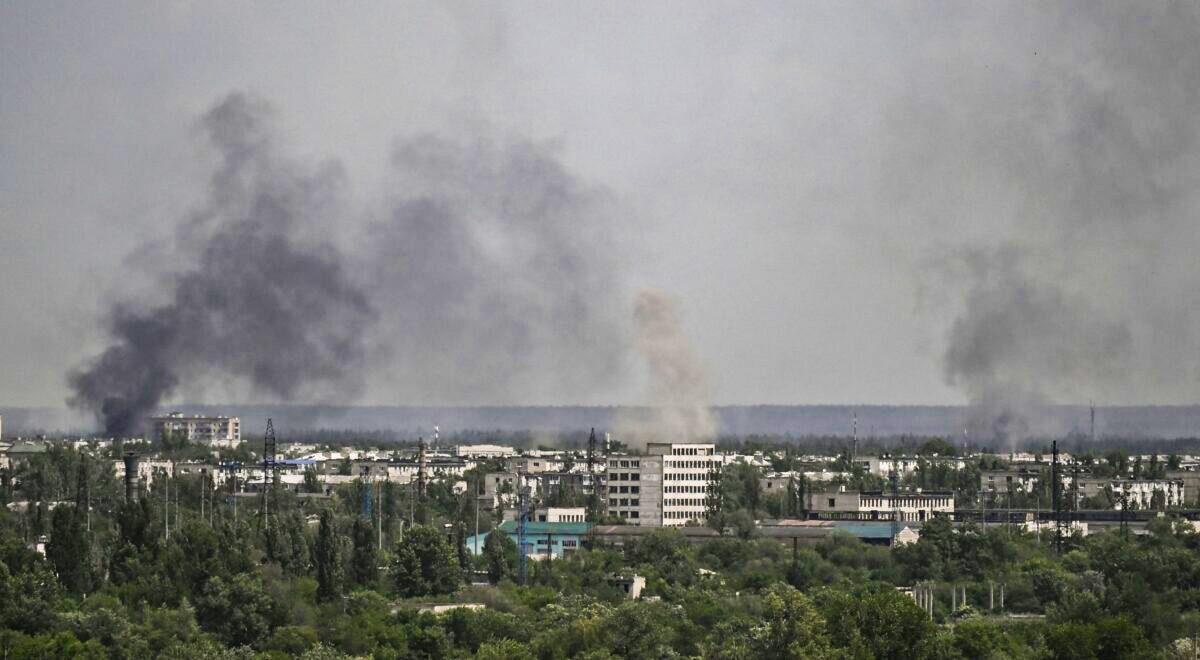Smoke and dirt rise from the city of Sievierodonetsk, during shelling in the eastern Ukrainian region of Donbas, on May 26, 2022, amid Russia's military invasion launched on Ukraine. (Aris Messinis/AFP via Getty Images)