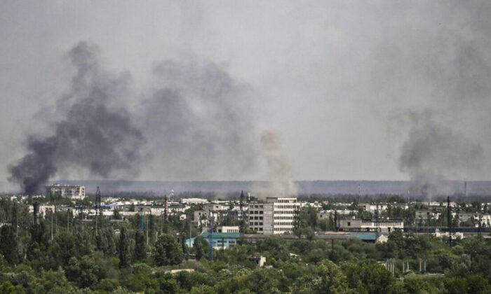 Two Reuters Journalists Injured, Driver Killed in East Ukraine
