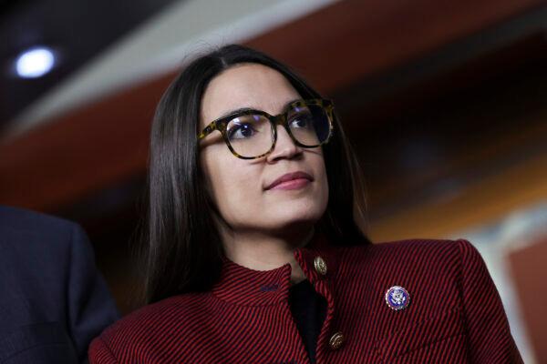 Rep. Alexandria Ocasio-Cortez (D-N.Y.) speaks on banning stock trades for members of Congress at a news conference on Capitol Hill on April 7, 2022. (Kevin Dietsch/Getty Images)
