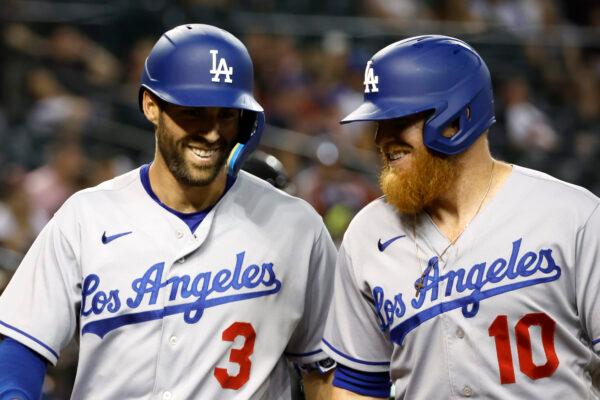 Justin Turner #10 laughs with teammate Chris Taylor #3 of the Los Angeles Dodgers after Taylor's two run home run during the eighth inning against the Arizona Diamondbacks at Chase Field, in Phoenix, on May 26, 2022. (Chris Coduto/Getty Images)