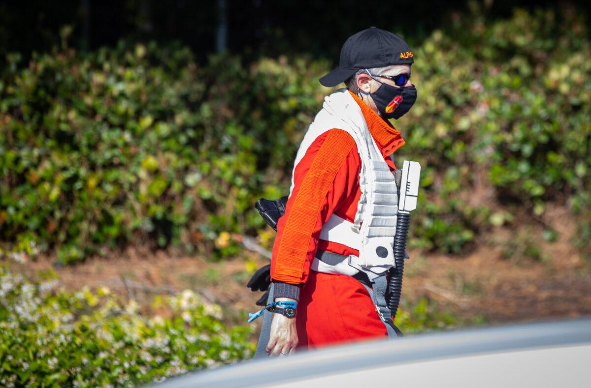 A Star Wars fan walks along Harbor Blvd. in Anaheim, Calif., on May 26, 2022. (John Fredricks/The Epoch Times)