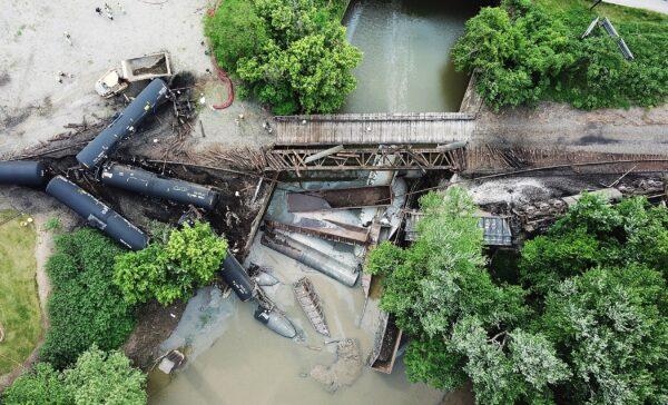 The scene of a derailed freight train that dumped several train cars into the Allegheny River in Harmar, Pennsylvania, on May 26, 2022. (Matt Freed/Pittsburgh Post-Gazette/TNS)