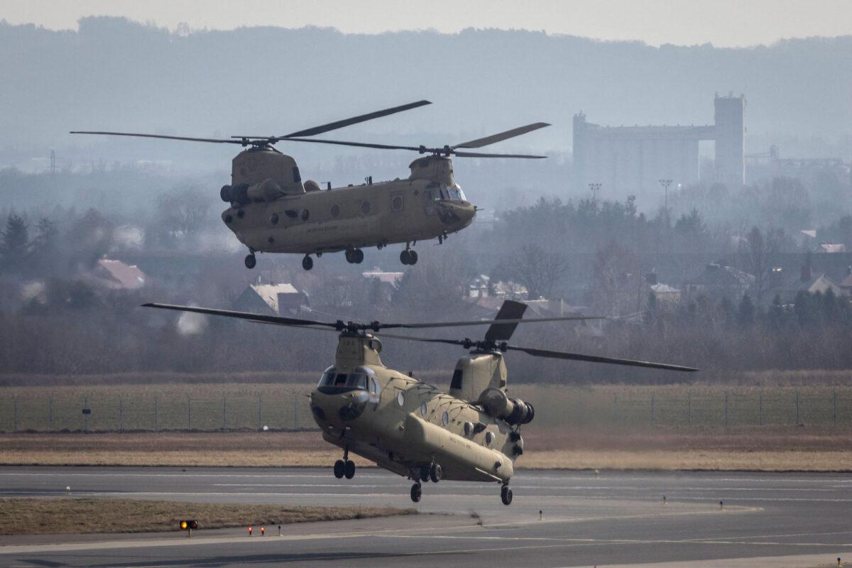 U.S. Air Force CH-47 Chinook helicopters are seen landing at the airport in Jasionka near Rzeszow, Poland, on Feb. 16, 2022. (Wojtek Radwanski/AFP/Getty Images)