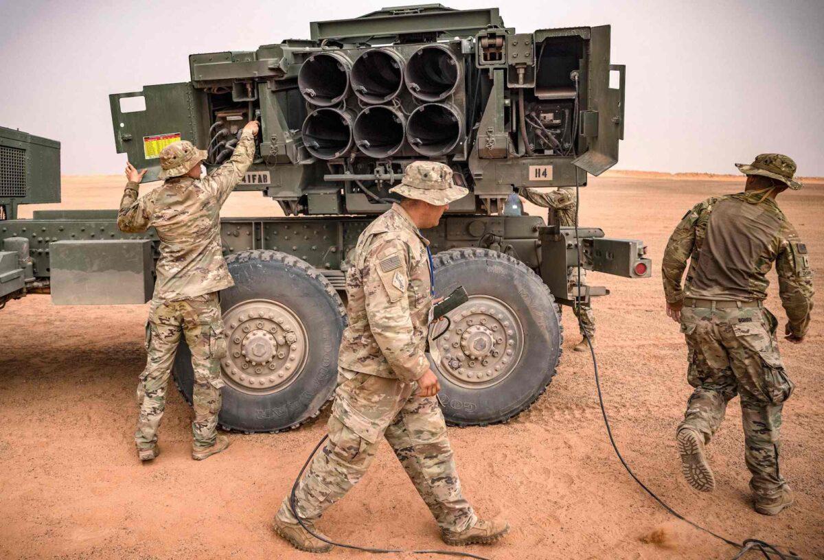 U.S. soldiers are seen attending to an M142 High Mobility Artillery Rocket System (HIMARS) launcher vehicle, during a military exercise in the Grier Labouihi region, in Morocco, on June 9, 2021. (Fadel Senna/AFP/Getty Images)