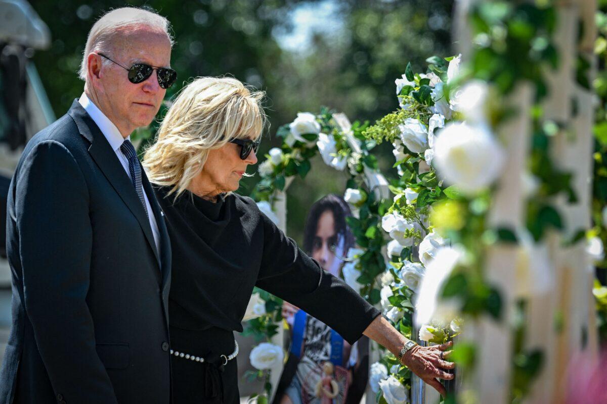 President Joe Biden and First Lady Jill Biden pay their respects at a makeshift memorial outside of Robb Elementary School in Uvalde, Texas, on May 29, 2022. (Mandel Ngan/AFP via Getty Images)