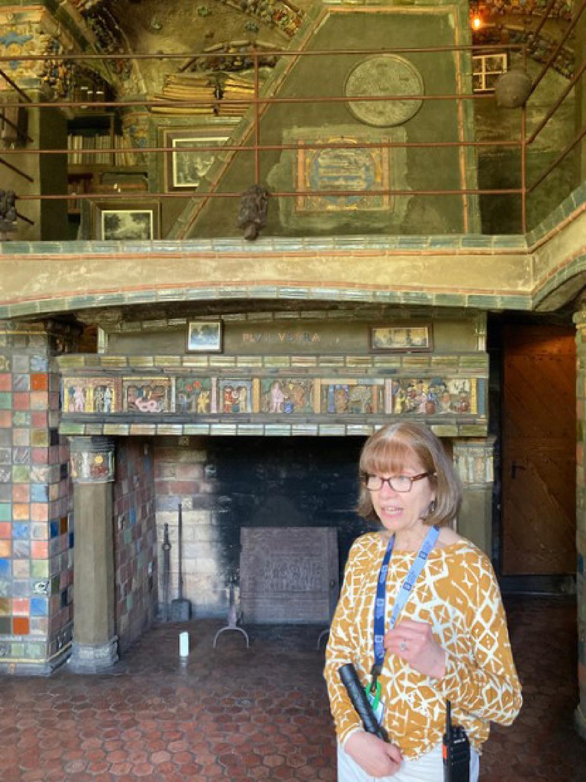 Lisa Crawford points out features of Henry Chapman Mercer's Fonthill Castle in Doylestown, Pa. (Bill Neely.)